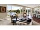 Bright living room area with lake view, comfortable chairs and opens to the kitchen at 5521 Salem N Dr, Carmel, IN 46033