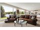 Relaxing living room with comfortable seating, large windows showcasing lake views, and open to the kitchen at 5521 Salem N Dr, Carmel, IN 46033