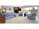 Bright main bedroom featuring a fireplace, sitting area and a large window with a view of the lake at 5521 Salem N Dr, Carmel, IN 46033