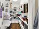 Well-organized walk-in pantry with ample shelving for food and storage items at 5521 Salem N Dr, Carmel, IN 46033