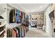 Well-organized walk-in closet with shelves, hanging rods, drawers, and plenty of room for storage at 5521 Salem N Dr, Carmel, IN 46033