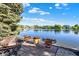 Stunning water view with a fire pit and elegant flower urns at 5521 Salem N Dr, Carmel, IN 46033