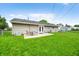 Spacious backyard featuring a patio with outdoor seating, a shed, and lush green grass at 605 Memorial Dr, Edinburgh, IN 46124