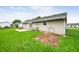 View of backyard with grass and patio area with chairs outside of home at 605 Memorial Dr, Edinburgh, IN 46124