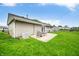 Exterior view of house with patio and green lawn, perfect for enjoying outdoor living and entertaining at 605 Memorial Dr, Edinburgh, IN 46124