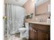 Bathroom featuring shower and tub combo, vanity with sink, and modern fixtures at 605 Memorial Dr, Edinburgh, IN 46124