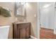 Bathroom with modern vanity, framed mirror, and neutral colored walls at 605 Memorial Dr, Edinburgh, IN 46124