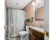 Cozy bathroom with shower and tub combo, vanity with sink, and modern fixtures at 605 Memorial Dr, Edinburgh, IN 46124