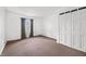 Bedroom with neutral carpet, a window with curtains, and a closet at 605 Memorial Dr, Edinburgh, IN 46124