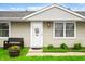 Inviting front porch with a bench, flower pot, and well-maintained landscaping at 605 Memorial Dr, Edinburgh, IN 46124