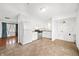 Open kitchen with stainless steel appliances, white cabinetry, and tile flooring at 605 Memorial Dr, Edinburgh, IN 46124