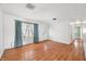 Bright living room with hardwood floors and large window adorned with stylish curtains at 605 Memorial Dr, Edinburgh, IN 46124