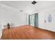 Inviting living room featuring hardwood floors and a decorative window with blue curtains at 605 Memorial Dr, Edinburgh, IN 46124