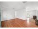Spacious living room with hardwood floors, ample natural light, and easy access to other rooms at 605 Memorial Dr, Edinburgh, IN 46124