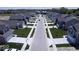 Aerial view of a residential neighborhood showcasing new homes with well-manicured lawns and tree-lined streets at 6219 Medina Spirit Dr, Indianapolis, IN 46237