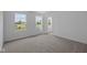 Bright bedroom with three windows and neutral carpet at 6219 Medina Spirit Dr, Indianapolis, IN 46237