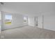 Spacious bedroom with neutral carpeting, multiple windows and natural light at 6219 Medina Spirit Dr, Indianapolis, IN 46237