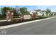A brick and stone sign welcomes you to Belmont, enhanced by landscaping and a well-maintained street at 6219 Medina Spirit Dr, Indianapolis, IN 46237