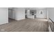 Open floorplan featuring wood-look floors throughout the living room and kitchen at 6219 Medina Spirit Dr, Indianapolis, IN 46237