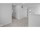 Upstairs hallway with neutral carpeting, white walls, and access to bedrooms and bathrooms at 6219 Medina Spirit Dr, Indianapolis, IN 46237