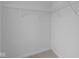 Walk-in closet with neutral carpeting, white walls, and wire shelving at 6219 Medina Spirit Dr, Indianapolis, IN 46237