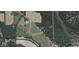 Aerial view of the property surrounded by lush greenery and open fields at 7897 Moore Rd, Indianapolis, IN 46278