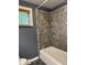 Bathroom featuring a tiled shower and modern tub at 7897 Moore Rd, Indianapolis, IN 46278