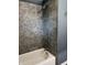 Bathroom with tiled shower, bathtub, and silver fixtures at 7897 Moore Rd, Indianapolis, IN 46278