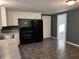 Eat-in kitchen with appliances and tile flooring at 7897 Moore Rd, Indianapolis, IN 46278