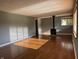 Bright living room with hardwood floors and a modern wood-burning stove at 7897 Moore Rd, Indianapolis, IN 46278