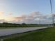 View of a country road surrounded by trees under a cloudy sky at 7897 Moore Rd, Indianapolis, IN 46278