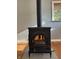 Modern and stylish wood-burning stove in the living room at 7897 Moore Rd, Indianapolis, IN 46278