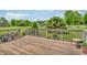Exterior wooden deck overlooking the tree-filled backyard at 802 Echo Trl, Martinsville, IN 46151