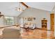Bright living room with hardwood floors, vaulted ceilings, a ceiling fan, and comfortable seating at 802 Echo Trl, Martinsville, IN 46151