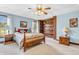 Tranquil main bedroom featuring soft carpet, wood furniture, and bright windows at 802 Echo Trl, Martinsville, IN 46151