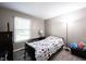 Bedroom with new flooring, neutral paint and a large window at 8066 Cardinal Cove E Dr, Indianapolis, IN 46256
