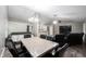 Dining room table with seating for six along with a living room and fireplace visible at 8066 Cardinal Cove E Dr, Indianapolis, IN 46256