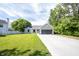 View of a charming single story house with an expansive front lawn at 8066 Cardinal Cove E Dr, Indianapolis, IN 46256