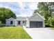 Charming home with a well-manicured lawn and attached two car garage at 8066 Cardinal Cove E Dr, Indianapolis, IN 46256