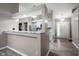 Open concept kitchen/entryway features light gray cabinets and white marbled countertops at 8066 Cardinal Cove E Dr, Indianapolis, IN 46256