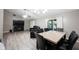 Living and dining area with ceiling fan and modern furnishings and a view of the water at 8066 Cardinal Cove E Dr, Indianapolis, IN 46256