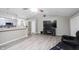 Living room showcases flat screen television, stylish flooring, and modern design elements at 8066 Cardinal Cove E Dr, Indianapolis, IN 46256