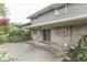 An inviting backyard patio with stone accents, sliding glass doors, and well maintained landscaping at 8903 Maple Hill Dr, Indianapolis, IN 46239
