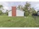 Home's backyard featuring a well-maintained lawn at 8903 Maple Hill Dr, Indianapolis, IN 46239