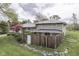 Scenic backyard with a privacy fence, mature trees, and lovely landscaping elements at 8903 Maple Hill Dr, Indianapolis, IN 46239