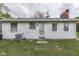 Backyard with lawn and access door at 8903 Maple Hill Dr, Indianapolis, IN 46239