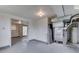 Finished basement with a door to another room, and utilities at 8903 Maple Hill Dr, Indianapolis, IN 46239