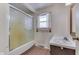 Bathroom with brick floor, tub and shower combination, and vanity with sink at 8903 Maple Hill Dr, Indianapolis, IN 46239