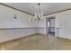 Dining room featuring neutral carpet, chandelier and view to kitchen at 8903 Maple Hill Dr, Indianapolis, IN 46239