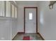 Inviting foyer with slate flooring, a transom window and traditional wainscoting at 8903 Maple Hill Dr, Indianapolis, IN 46239